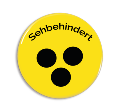 Svagsynet - Gult badge med tekst og sorte prikker (TYSK)